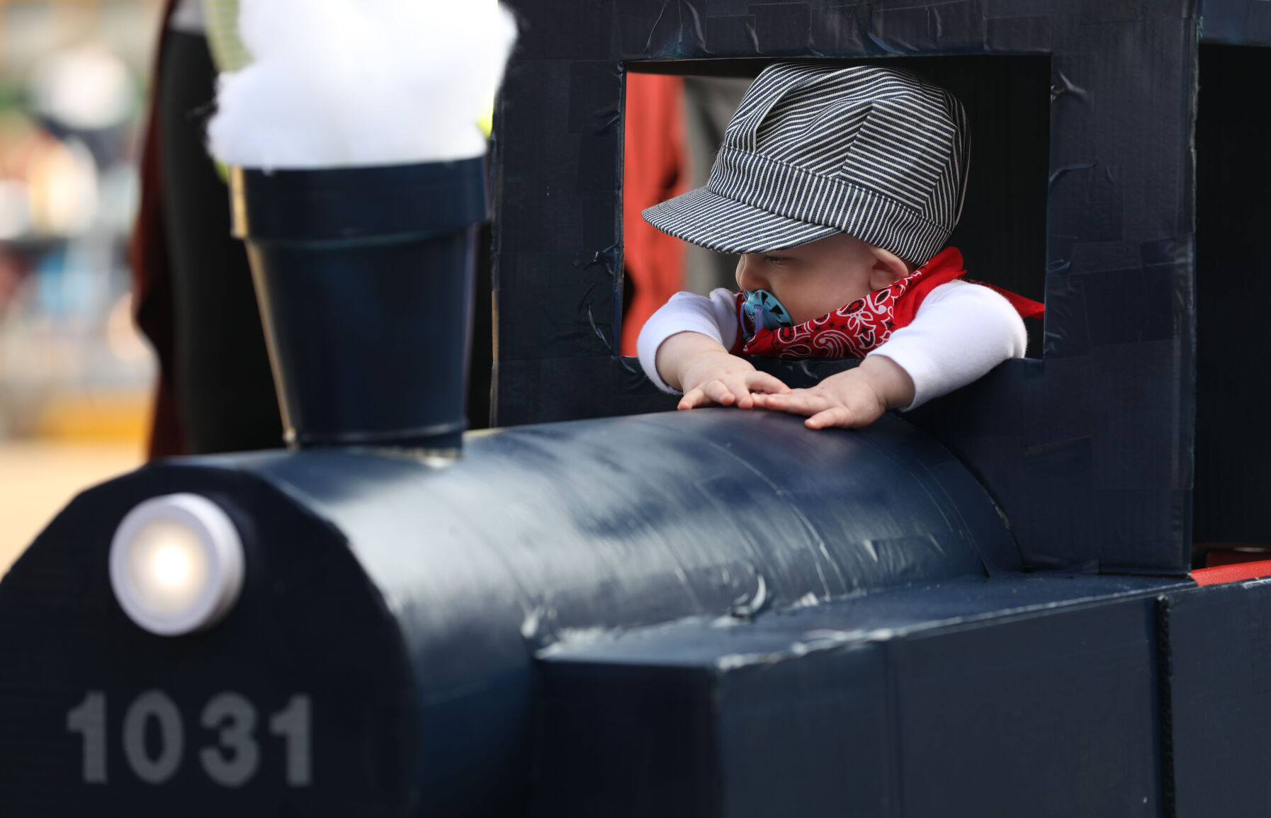 Rowan Ferraro peaks out of a train